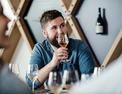 man tasting rose wine.