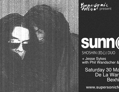 Black and white poster for SunnO)) concert at De La Warr Pavilion Bexhill