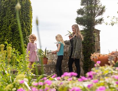 mother and children at Michelham Priory gardens