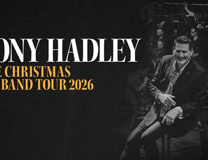 Poster for Tony Hadley “The Christmas Big Band Tour 2026,” featuring monochrome stage photo and bold white and gold text.