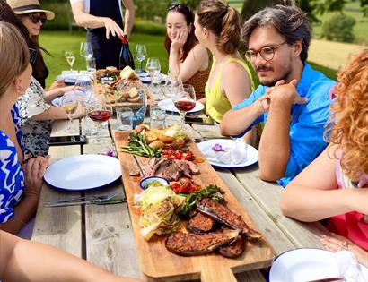 Vine + Country Wine Tours, guest seated around long al fresco table