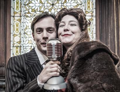 Two actors performing It's a Wonderful Life
