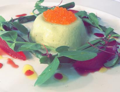A served plate with salmon caviar.