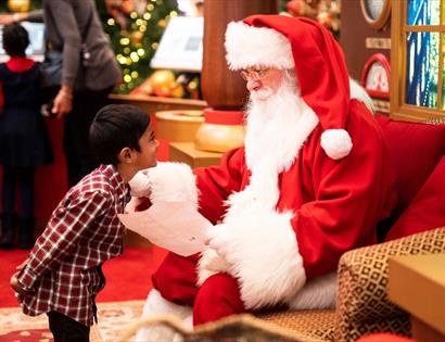 Photo of Santa and child with Christmas letter