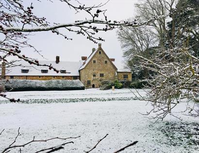 Photo of Michleham Priory in the snow.