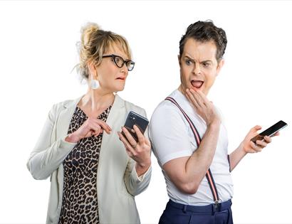 man and women checking their phones in disbelief