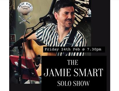 Poster of musician, young man with guitar, text says "the Jamie Smart solo show".
