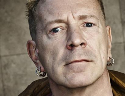 photograph. a close up portrait of John Lydon.