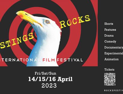 black poster with swirling red design and am image of a seagull's head.