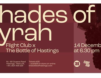 burgundy colour poster with grapes in the background. Title says 'Shades of Syrah'. Text in description.