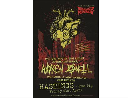 black and red poster for Andrew O'Neill at The Pig in Hastings. There is an illustration of a yellow heart.