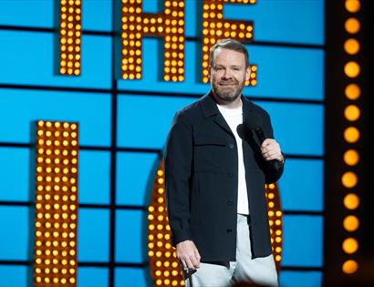a comedian performing at a gig
