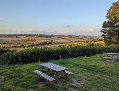 picnic bench overlooking country fields