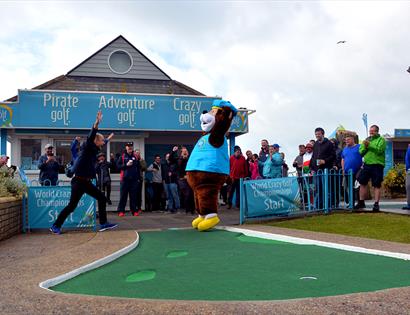 bear mascot leaping at hastings adventure golf