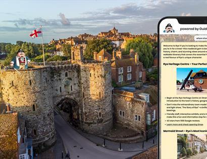 scenic aerial view of Rye, a historic town in East Sussex, England. The foreground shows the medieval stone gateway known as Landgate, with two round