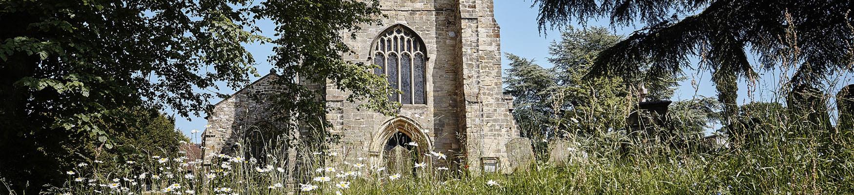 Outside walls of church and view from garden