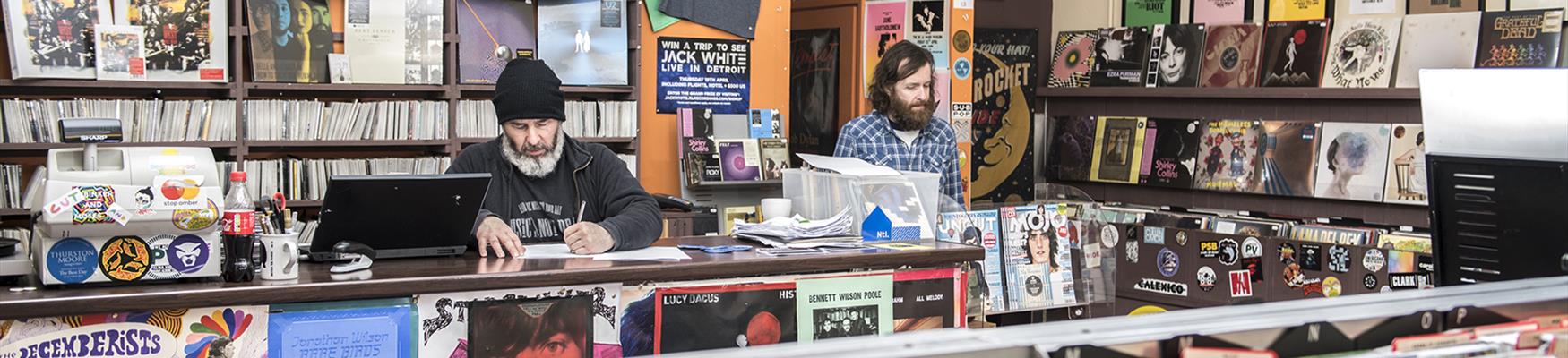 A man browsing records in Music's Not Dead in Bexhill