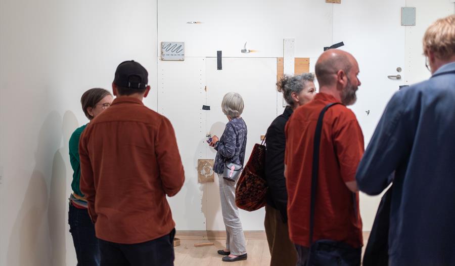 group looking at artworks at Hastings Contemporary.