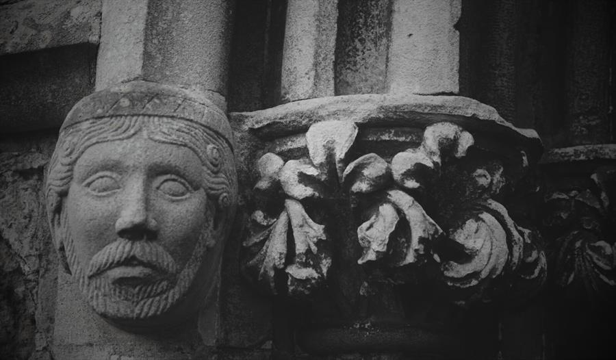 relief of face in stone architecture