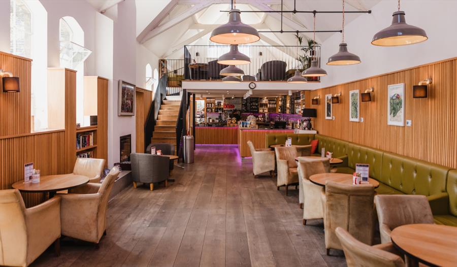 Kino Rye café with stylish seating, vaulted ceilings and a welcoming bar area in a converted historic building.