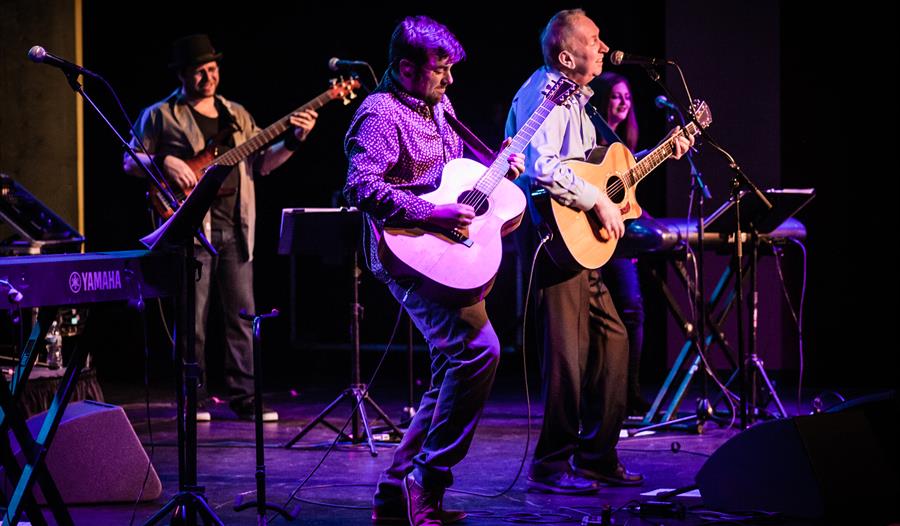 Photo of the band on stage