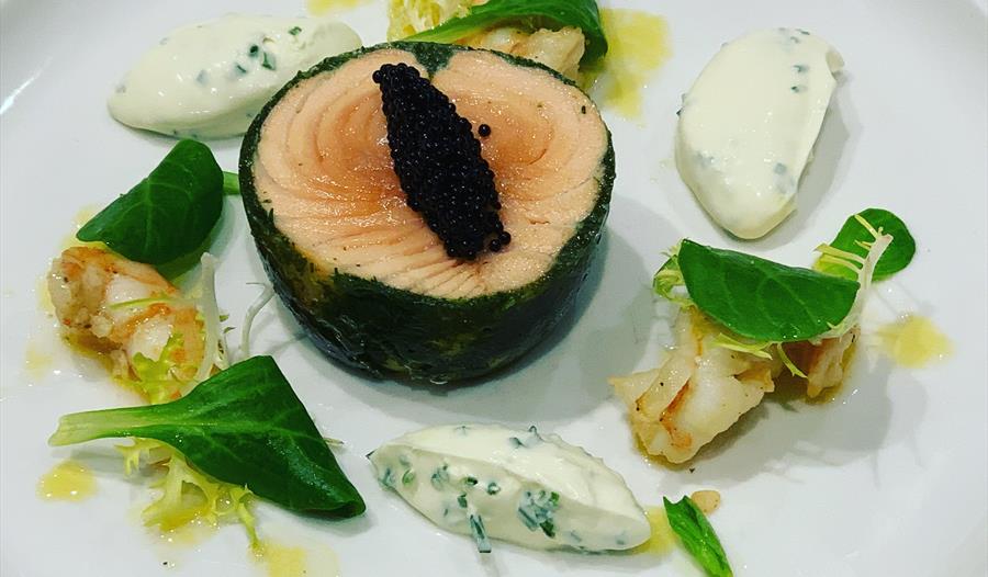 fish dish served on a plate.