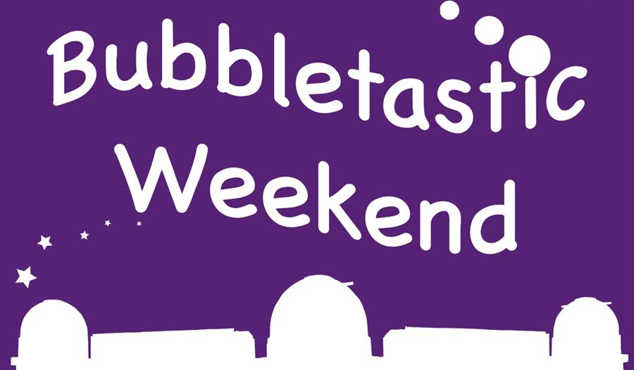 poster. purple background. Bottom has white silhouette of herstmonceux observatory domes. Text says bubbletastic weekend.