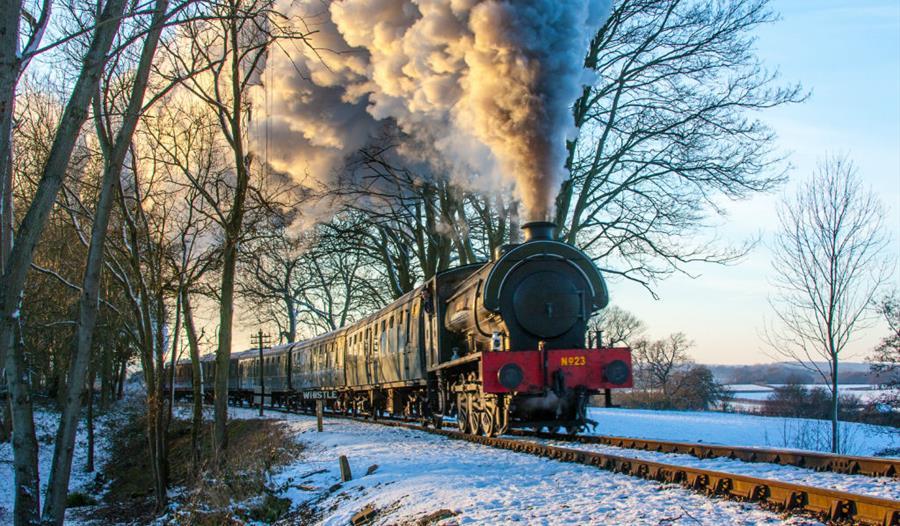 steam engine from front, in snowy landscape.