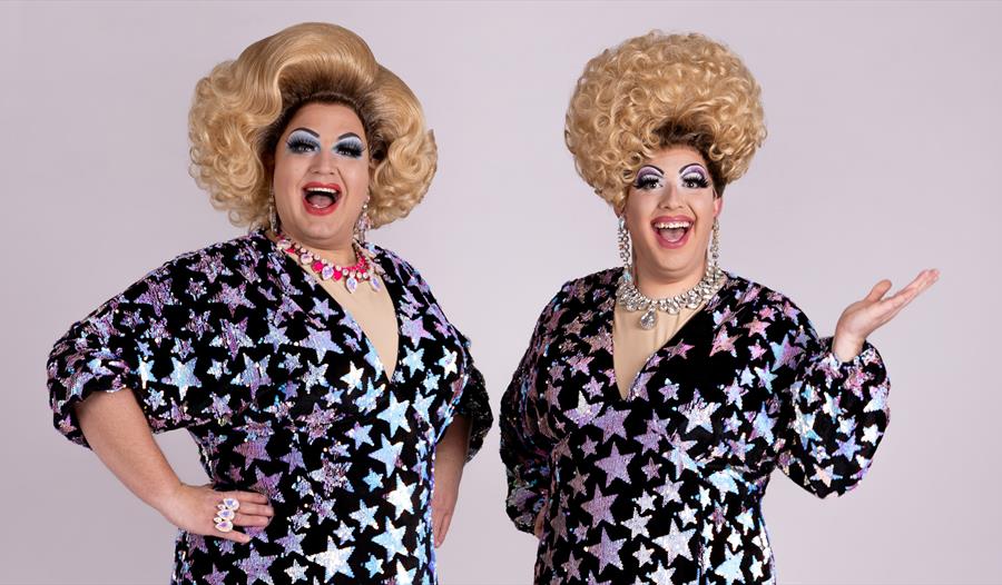 Promotional image for Drag Bingo Night at Merriments featuring two performers in sparkling star-patterned outfits