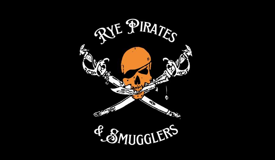 Black logo with orange skull wearing eyepatch above crossed swords, text reads “Rye Pirates & Smugglers.”