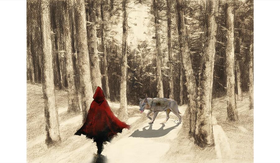 A red-hooded figure walks through a snowy forest as a wolf approaches along a pale, winding path.