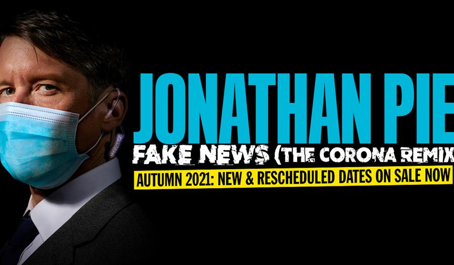 poster for Jonathan Pie at White Rock Theatre. Black background. White man in suit and blue face mask stands to left. Text says Jonathan Pie, Fake New