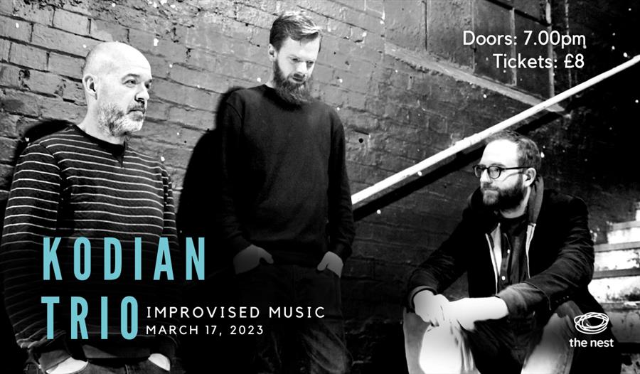 Poster with black and white photograph of three men standing and sitting on steps. Blue text in bottom left hand corner says "Kodian Trio" then "impro