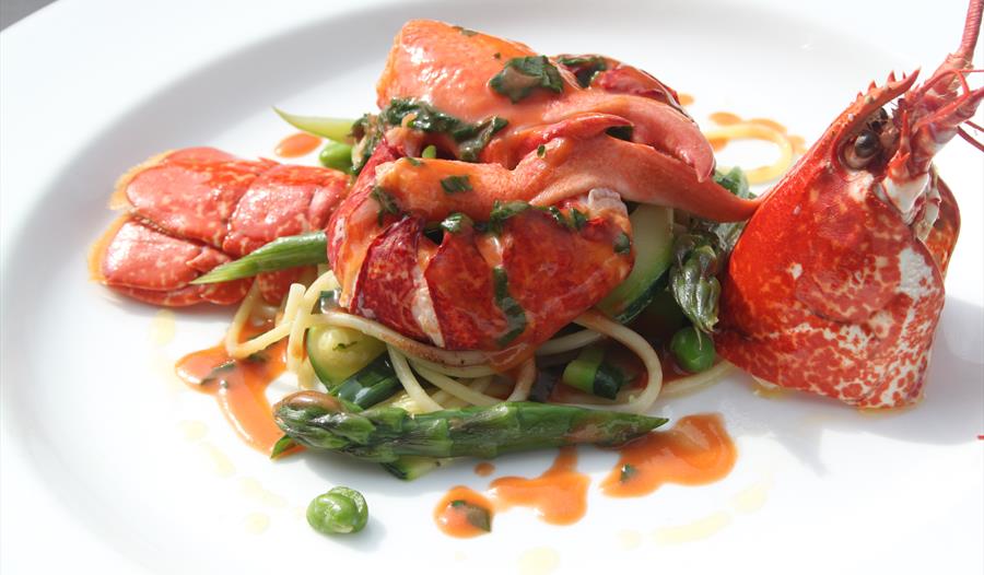 A gourmet lobster dish served plate.
