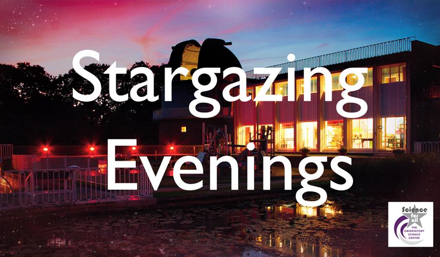 a photogrpah of a building at sunset, with orange lights in the building and blue and pink sky. Obstructed by large with letters that say Stargazing E