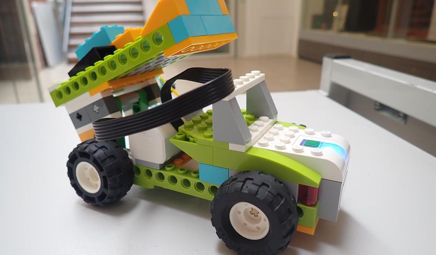 Lego vehicle on a table.