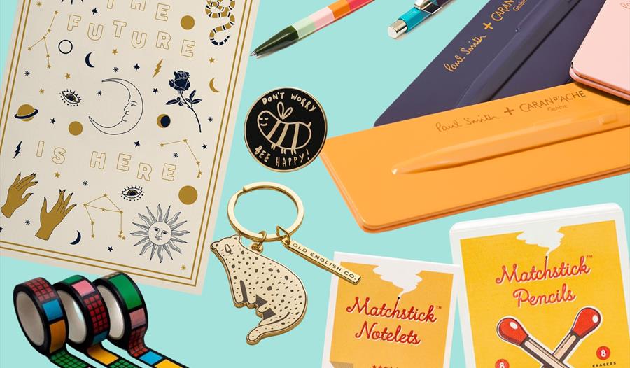 Illustration showing small gifts such as pencils, tape and keyrings.