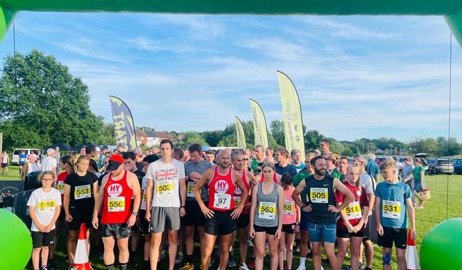 large group stood at running race start line