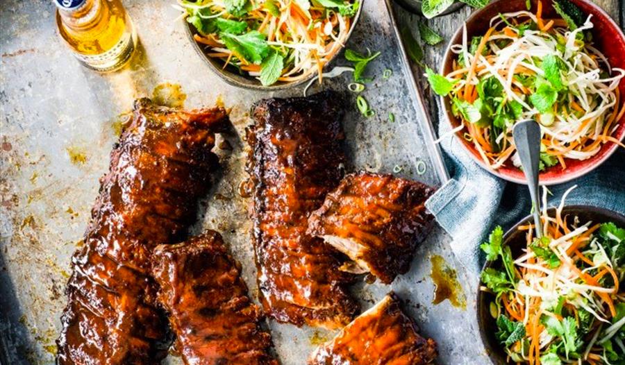Rack of BBQ ribs with salad and beer