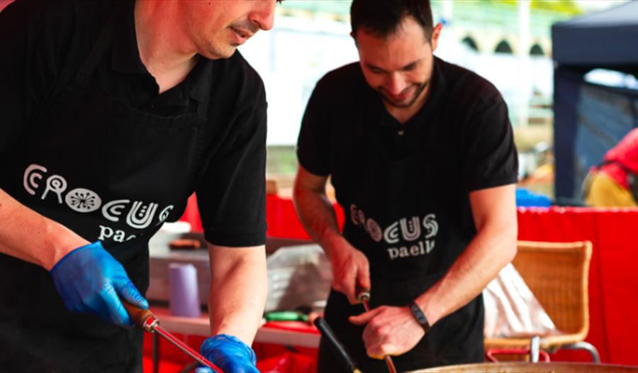 two chefs wearing black crocus paella t-shirts. For the hub bodiam food event, rother