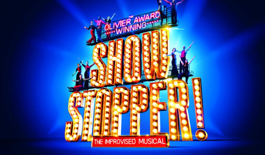 a graphic poster. Blue background with letters as big stag lights, reads Show Stopper!