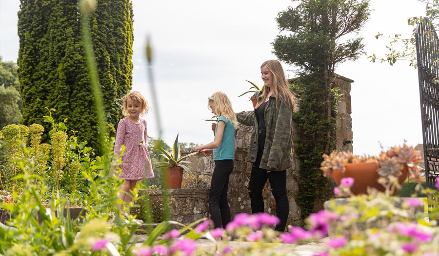 mother and children at Michelham Priory gardens