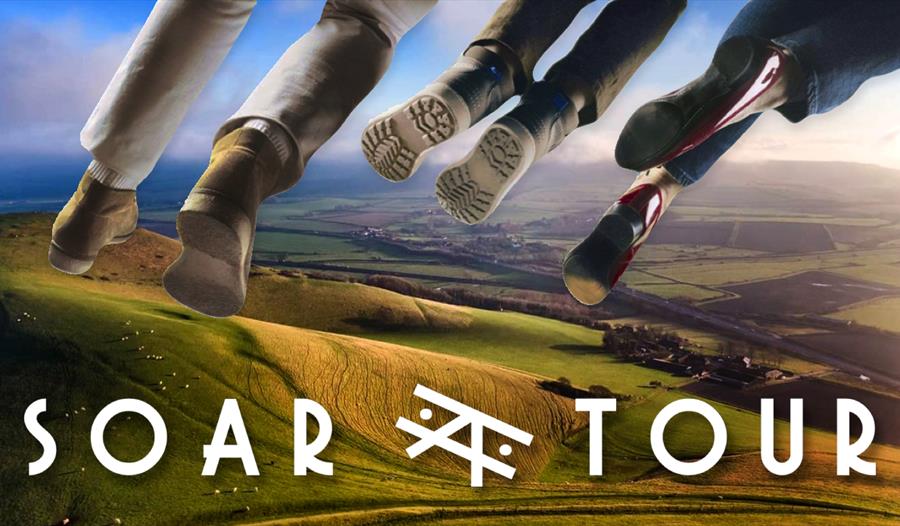 poster for SOAR TOUR shows feet dangling in the sky above rolling green hills