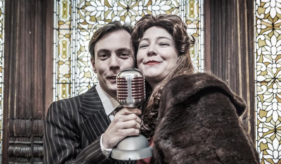 Two actors performing It's a Wonderful Life
