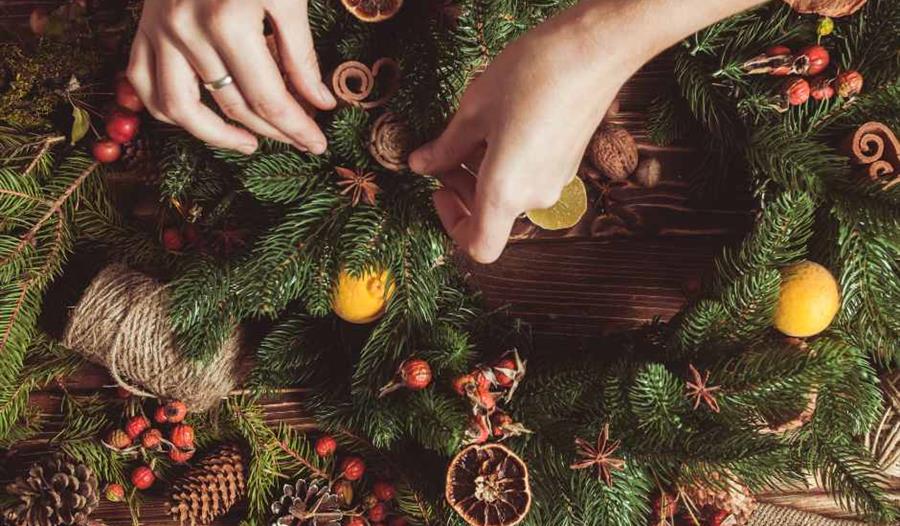 birds eye view of Christmas wreath-making workbench