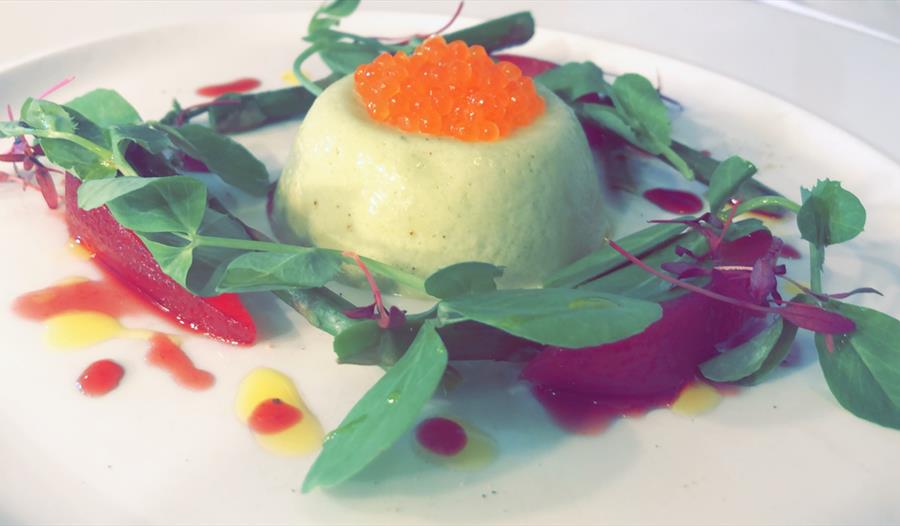 A served plate with salmon caviar.