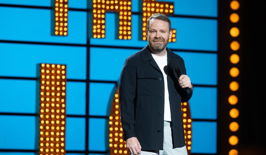 a comedian performing at a gig