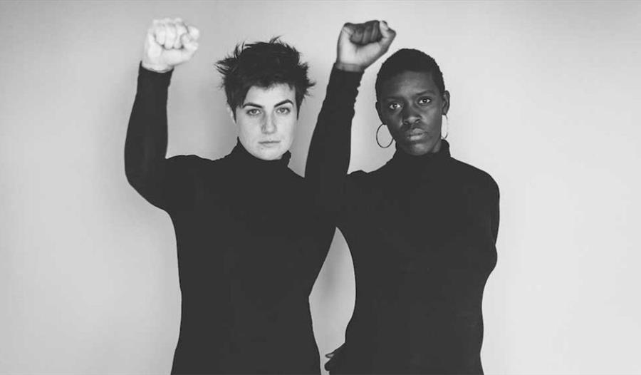 Photo of two women, one black, one white.