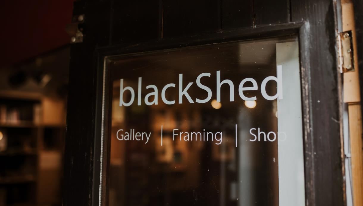 Entrance sign for BlackShed Gallery, framing studio and shop in Robertsbridge.