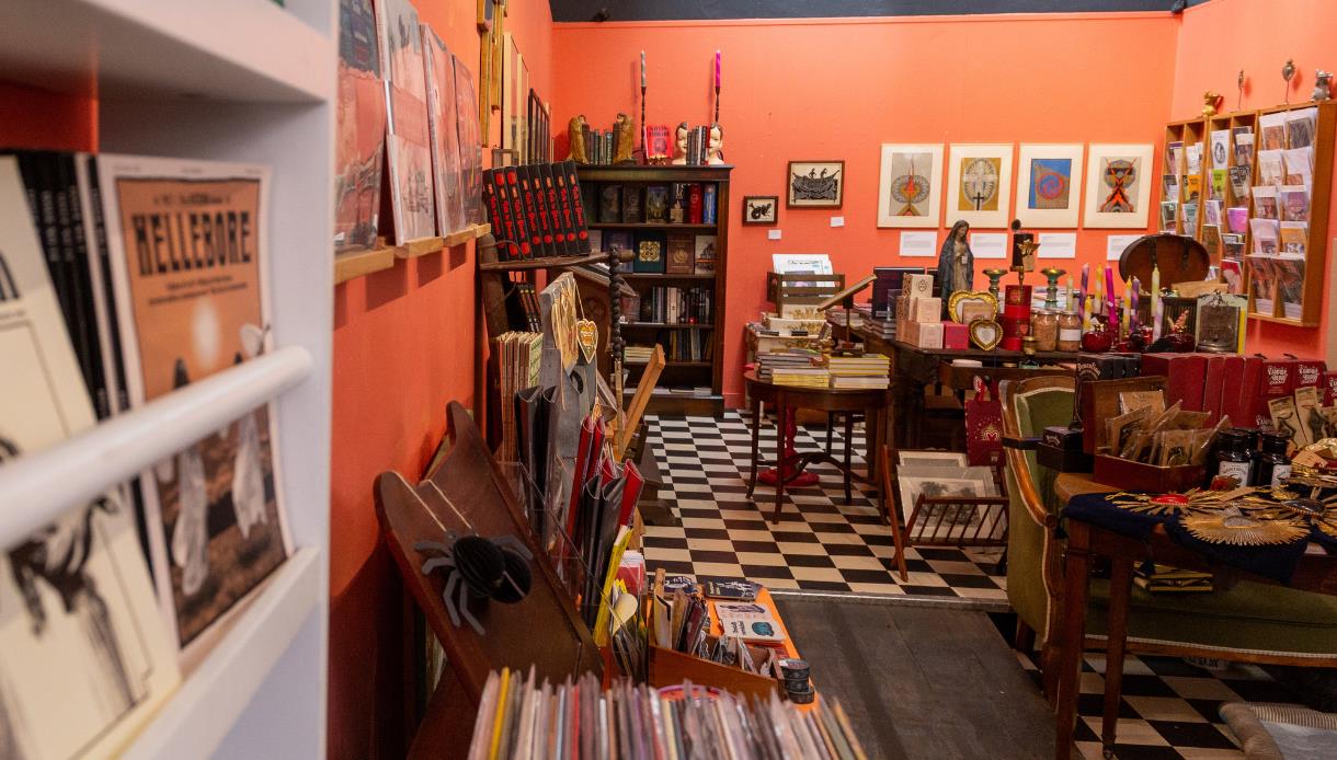 Interior of Tadhg Mae Projects in Hastings, showcasing books, artwork, gifts and eclectic displays